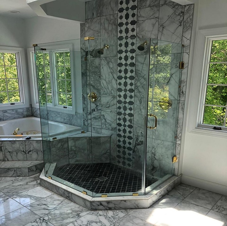 Frameless glass shower enclosures