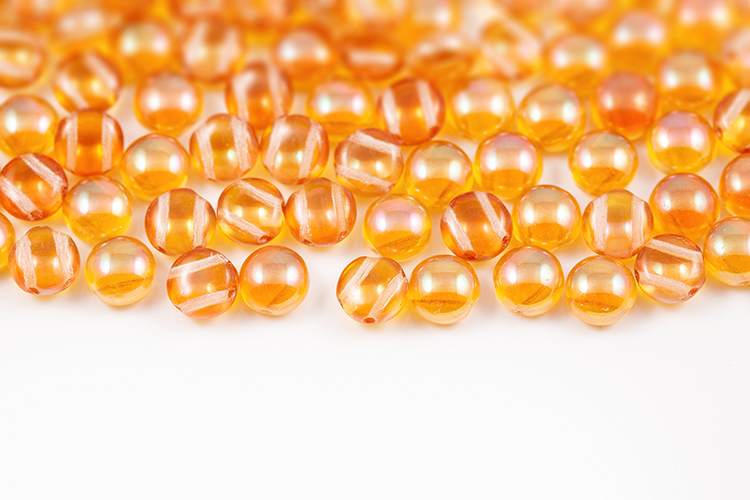 What are the differences between hand-pressed Czech glass beads and machine-pressed glass beads?