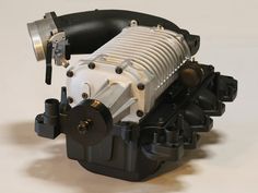 What is the difference between a roots blower and a screw blower?