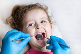 What are the benefits of fluoride treatment for your childrens teeth according to a pediatric dentist Carlsbad CA.
