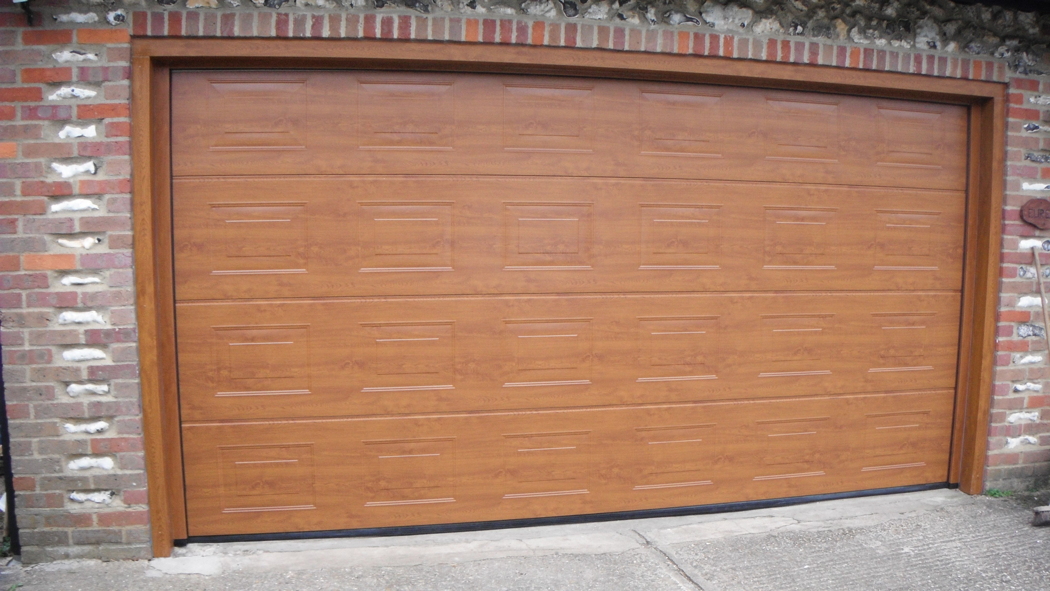 Upgrade Your Home with Insulated and Cedar Garage Doors