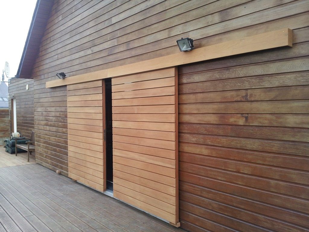 Choosing Between Timber and Insulated Garage Doors: Which is Right for You?