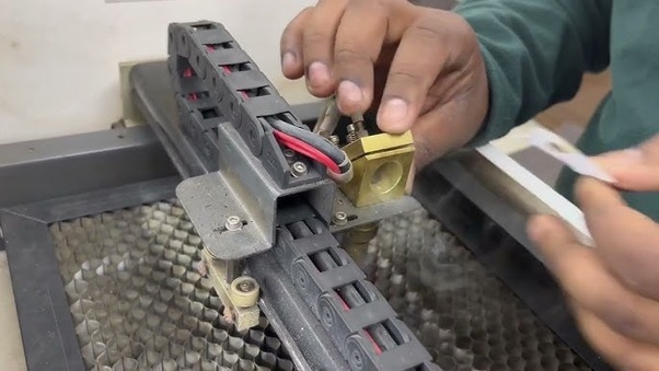 What dangers can be expected if the settings on a CO2 laser CNC machine are incorrectly adjusted?