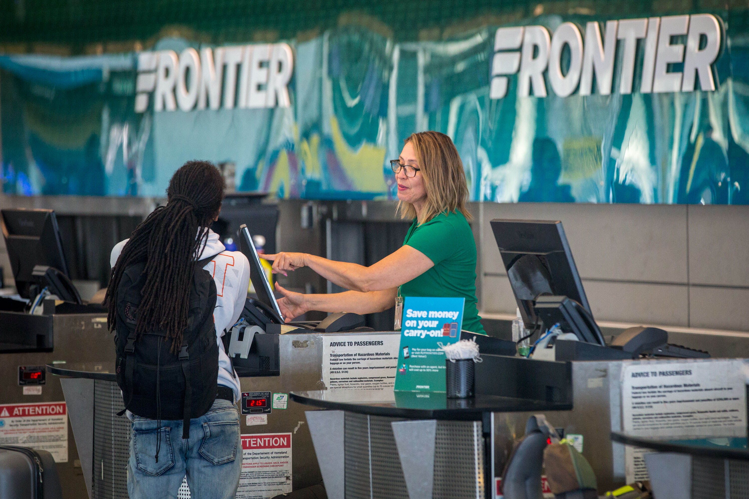 How can I speak to a live person at Frontier Airlines?