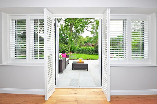The Practical and Aesthetic Benefits of Wood Window Shutters in Louisiana's Climate