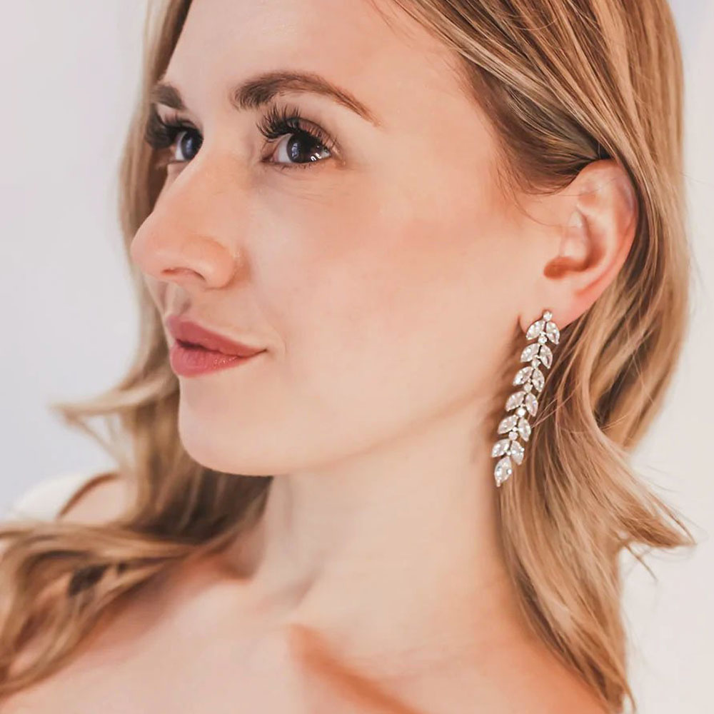 Topic: Elevating Your Bridal Style: The Art of Wearing Statement Earrings at Your Wedding